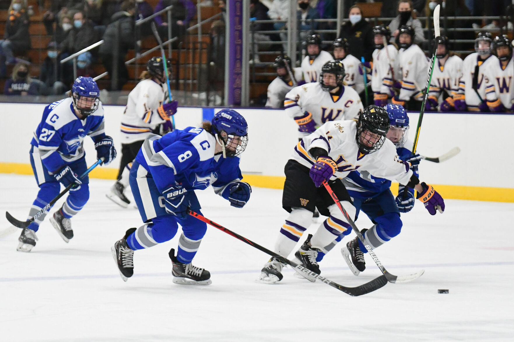 Tix goes for possession of the puck